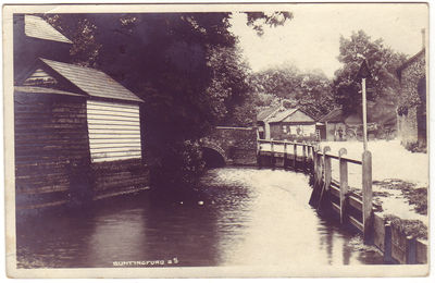 005 - Ford over the River
Robert H Clark's series posted in Buntingford and dated 26th July 1906 showing the river that caused Layston church it's access problems in the past, along with the bridge that crosses it and the brick building known as the Cage.
