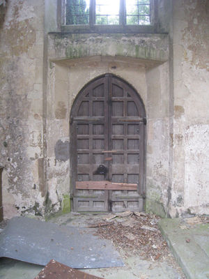 06 - West door from the base of the Tower
This door is the one with the crime attached to it. It's all intact but had a sheet of steel bolted to it with 10mm bolt's - about 20 of them :-(
